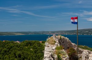 Croatia flag in windy weather bura in Istria